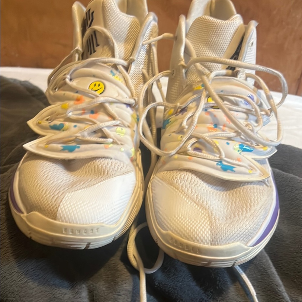 White and Yellow Sneakers with Unique Lacing and Textured Upper